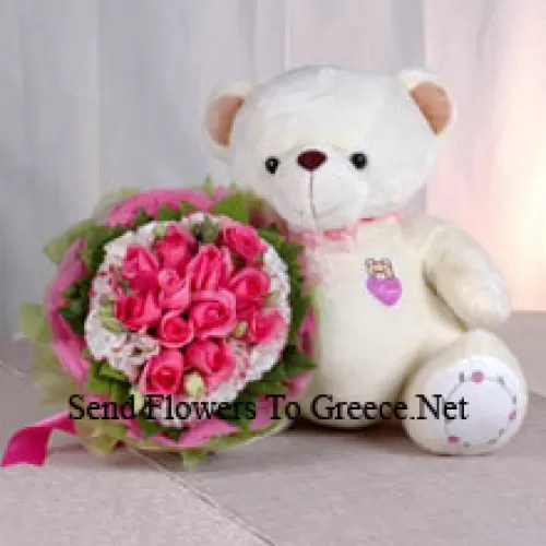 Um buquê de 11 rosas cor de rosa e um urso de pelúcia médio e fofo