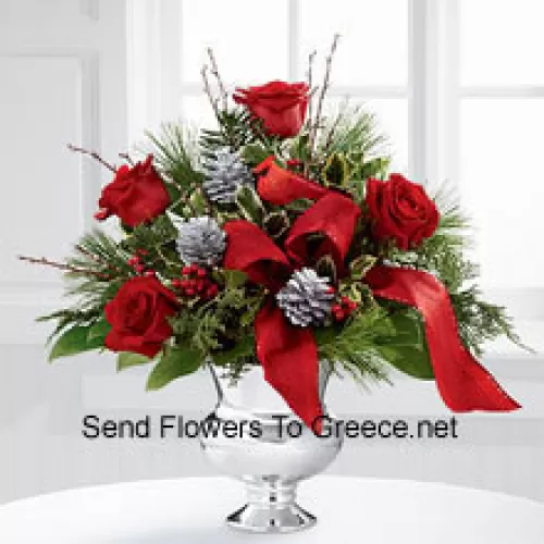 Highly elegant and bursting with your merriest wishes, this bouquet will create the perfect holiday gift. Rich red roses are vibrant and bright arranged with variegated holly, assorted holiday greens, silver pinecones and branches, all perfectly accented with a faux cardinal and designer red ribbon. Presented in a silver pedestal vase, this bouquet will add to the joy and festivities of their holiday season with each gorgeous bloom. (Please Note That We Reserve The Right To Substitute Any Product With A Suitable Product Of Equal Value In Case Of Non-Availability Of A Certain Product)